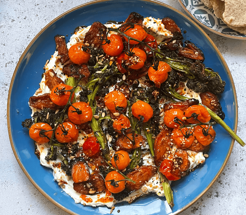 A plate of Kefir labneh with jammy tomatoes, carrots, and za’atar by Laura Tilt