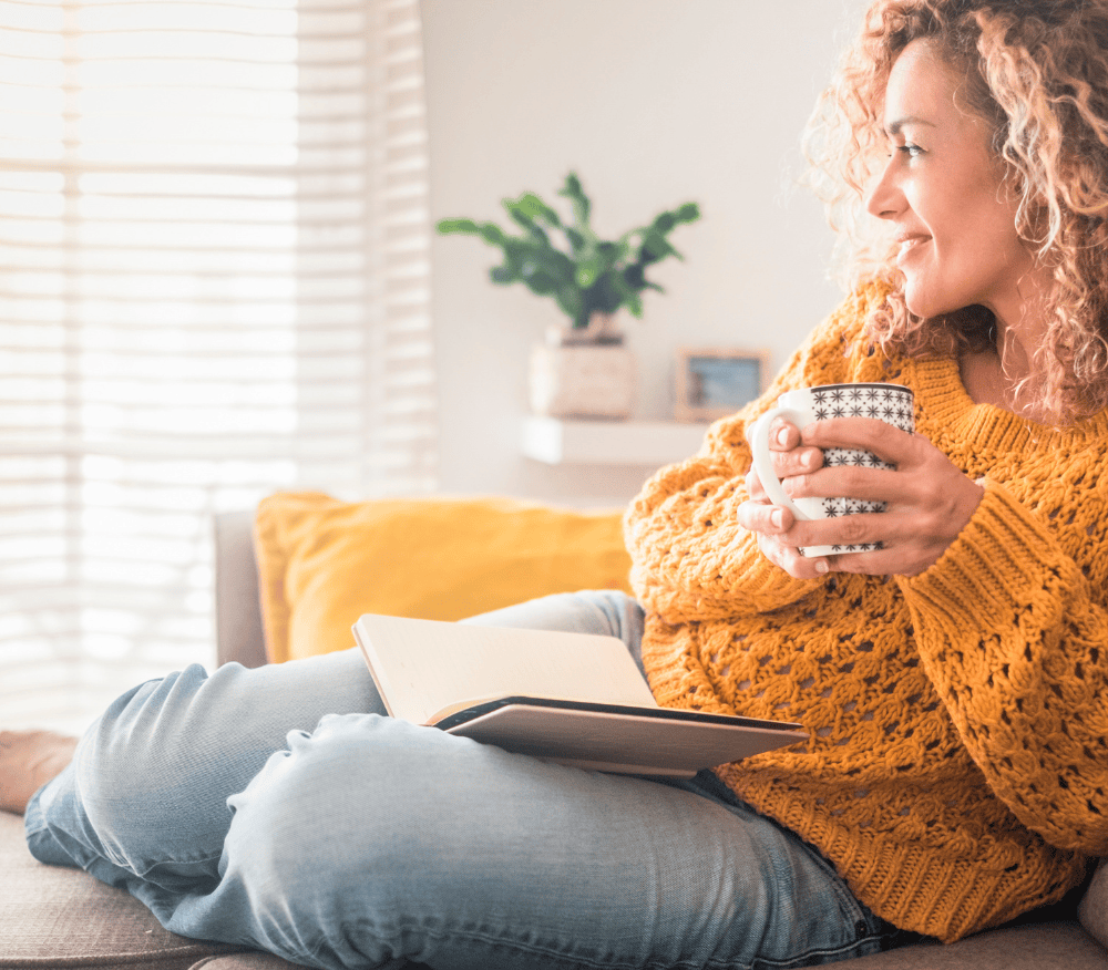 lady reading a book on the sofa